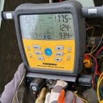 Mechanical contractor CT performing HVAC service with Fieldpiece digital gauge.